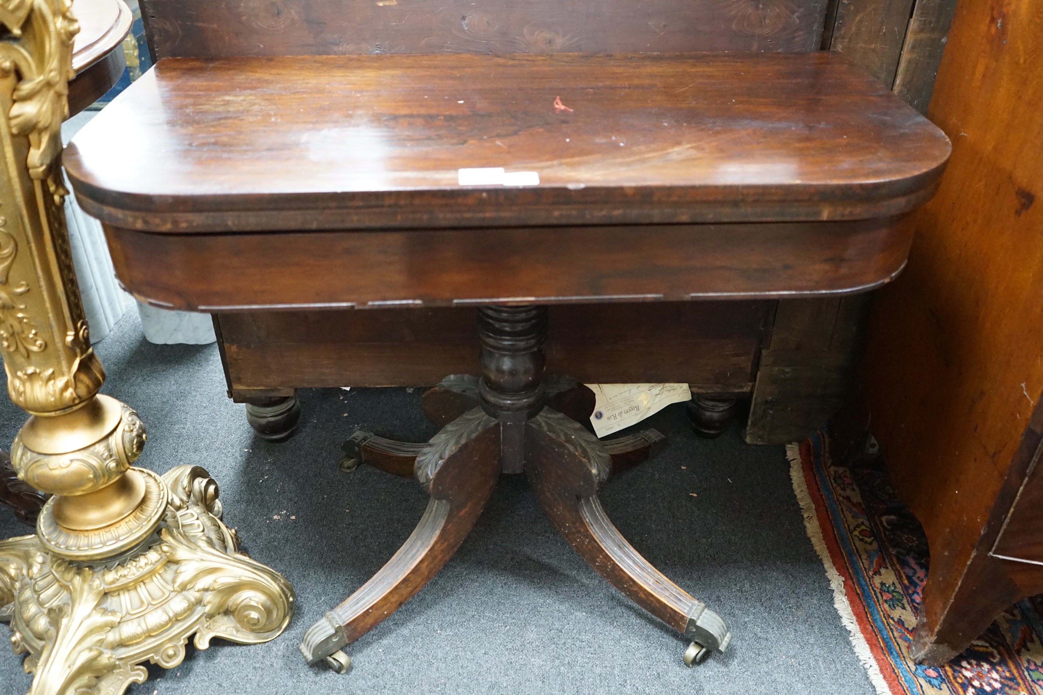 A Regency rosewood D shaped folding tea table, width 91cm, depth 45cm, height 72cm
